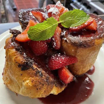 Pain Per Due, a Cajun French Toast, topped with strawberry